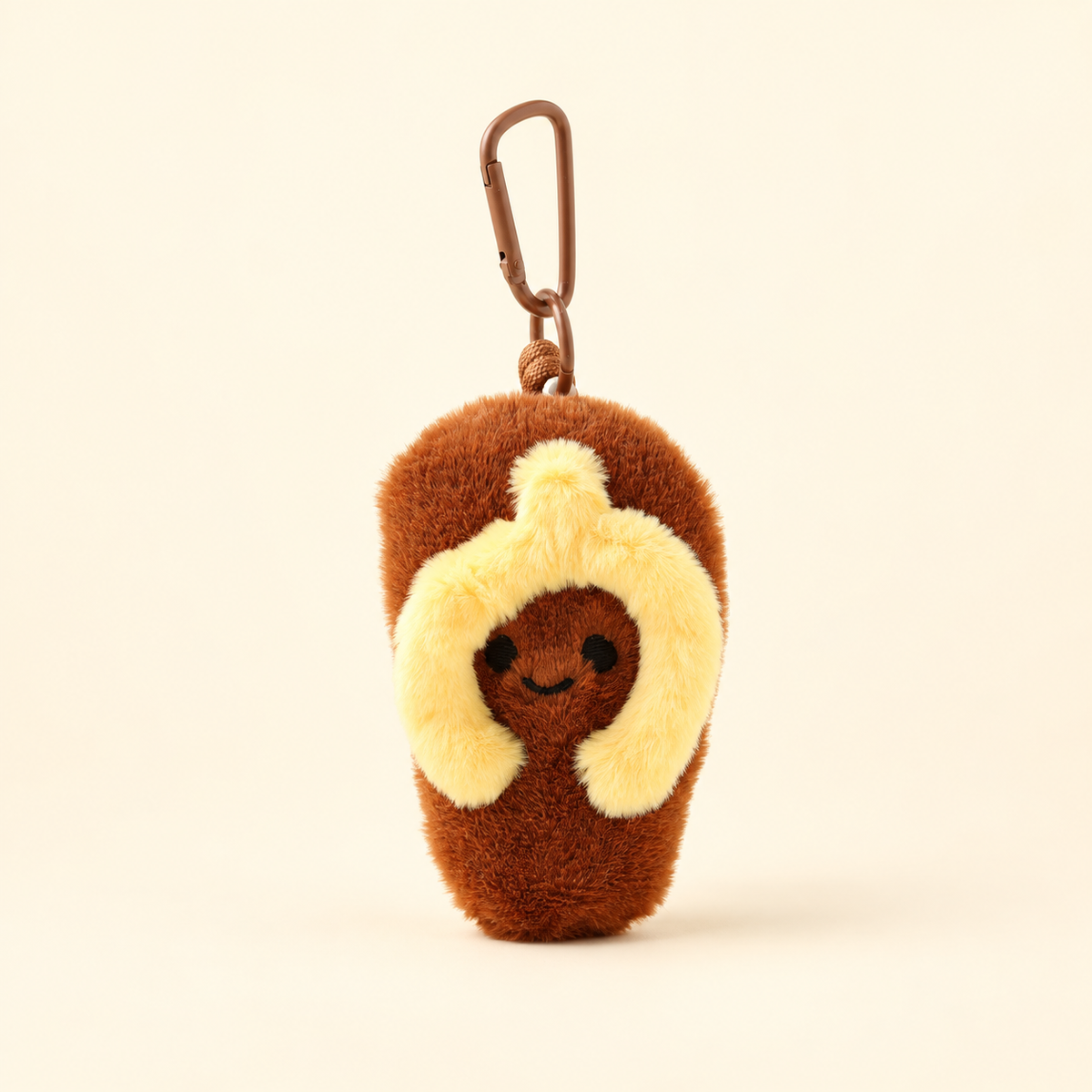 brown miniature plush flip-flop bag charm on ivory background