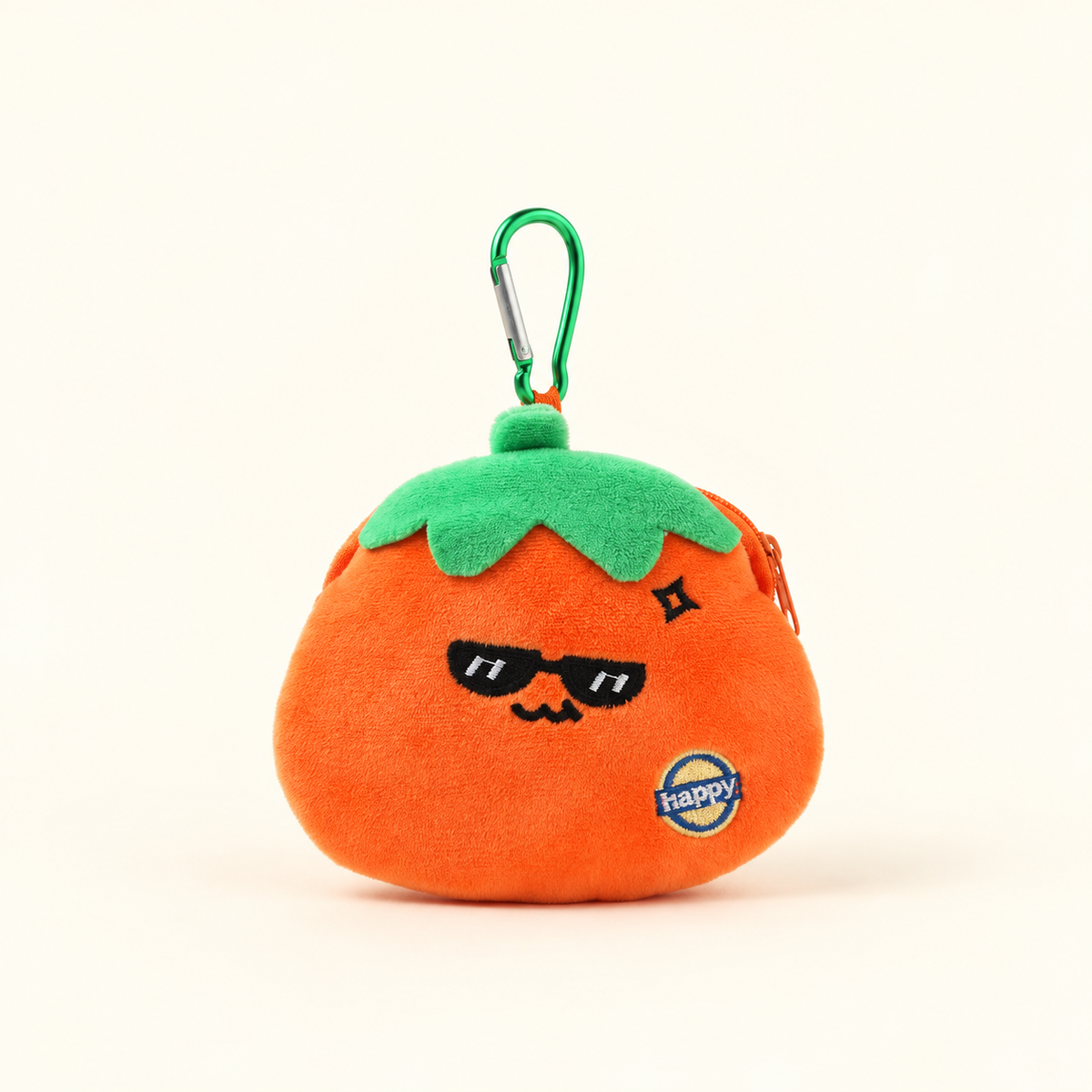 persimmon plush coin purse with green clip on ivory background