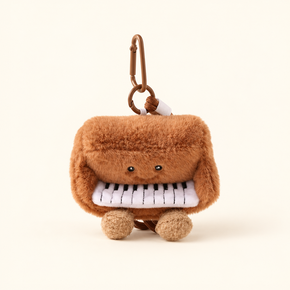 piano plush instrument bag charm on ivory background