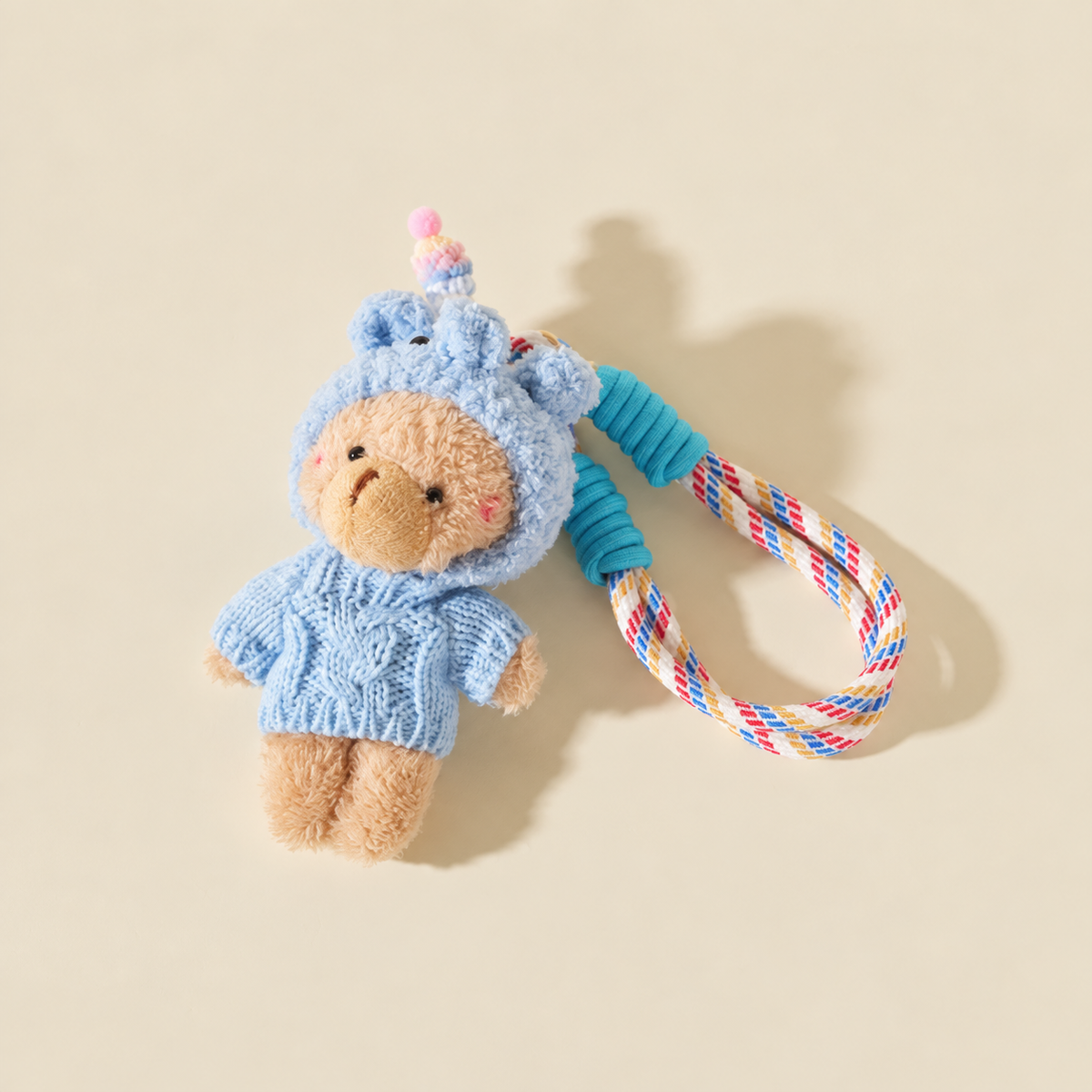 blue hooded sweater bear with rope loop on ivory background