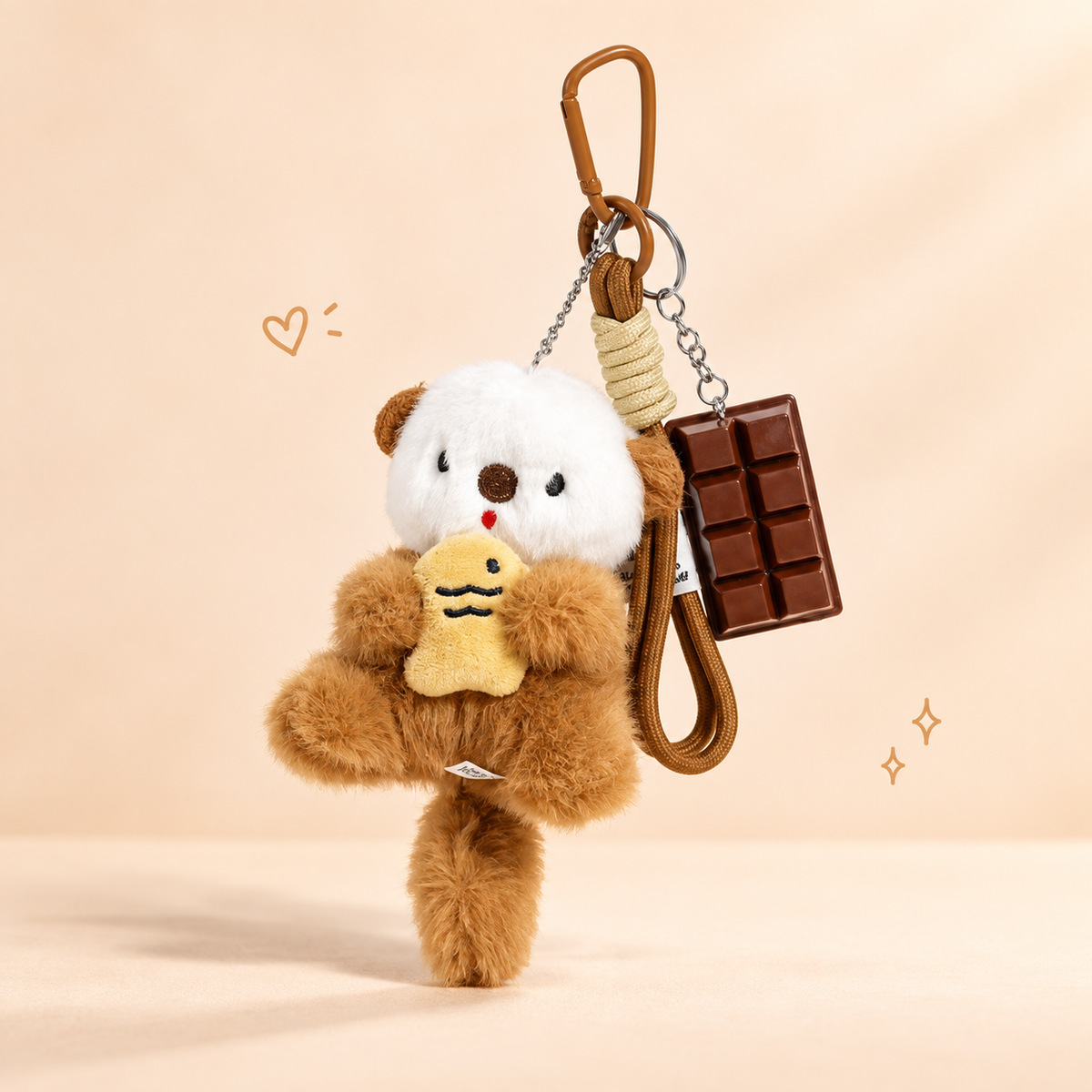 Baby Otter Plush Keychain on a softly lit cream and pastel background.