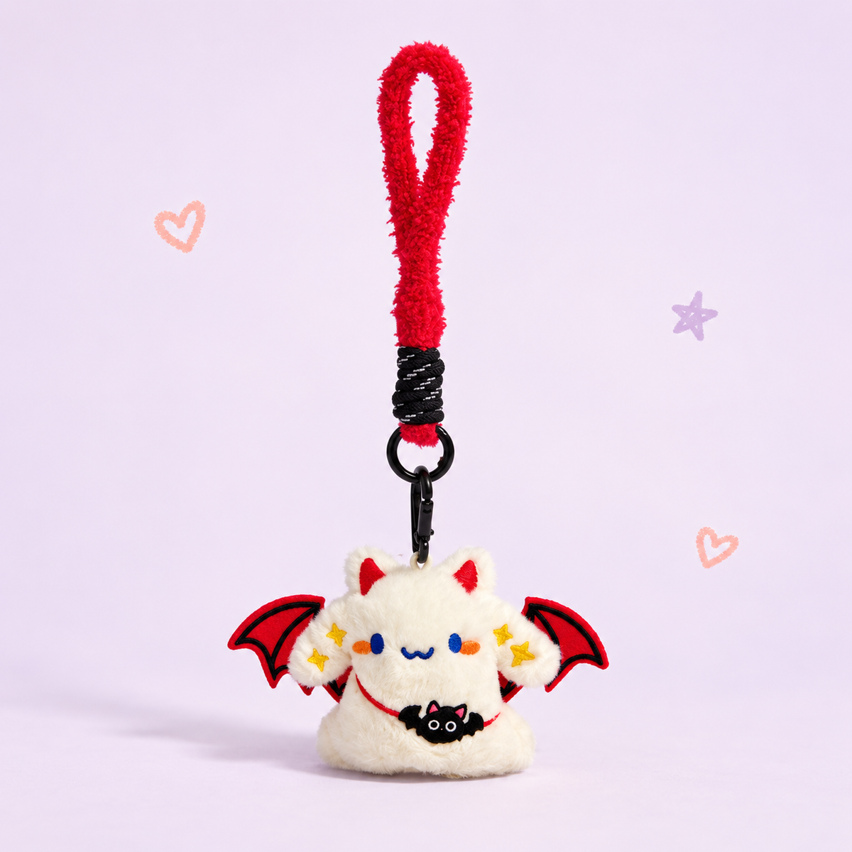 Bat Buddy Charm on a softly lit cream and pastel background.