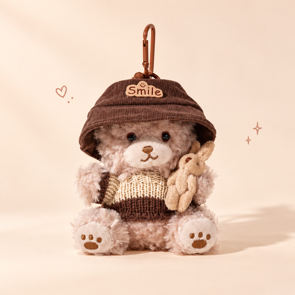 Bear Keychain on a softly lit cream and pastel background.