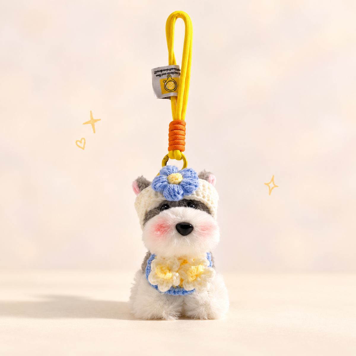 Cute Schnauzer Plush Keychain on a softly lit cream and pastel background.