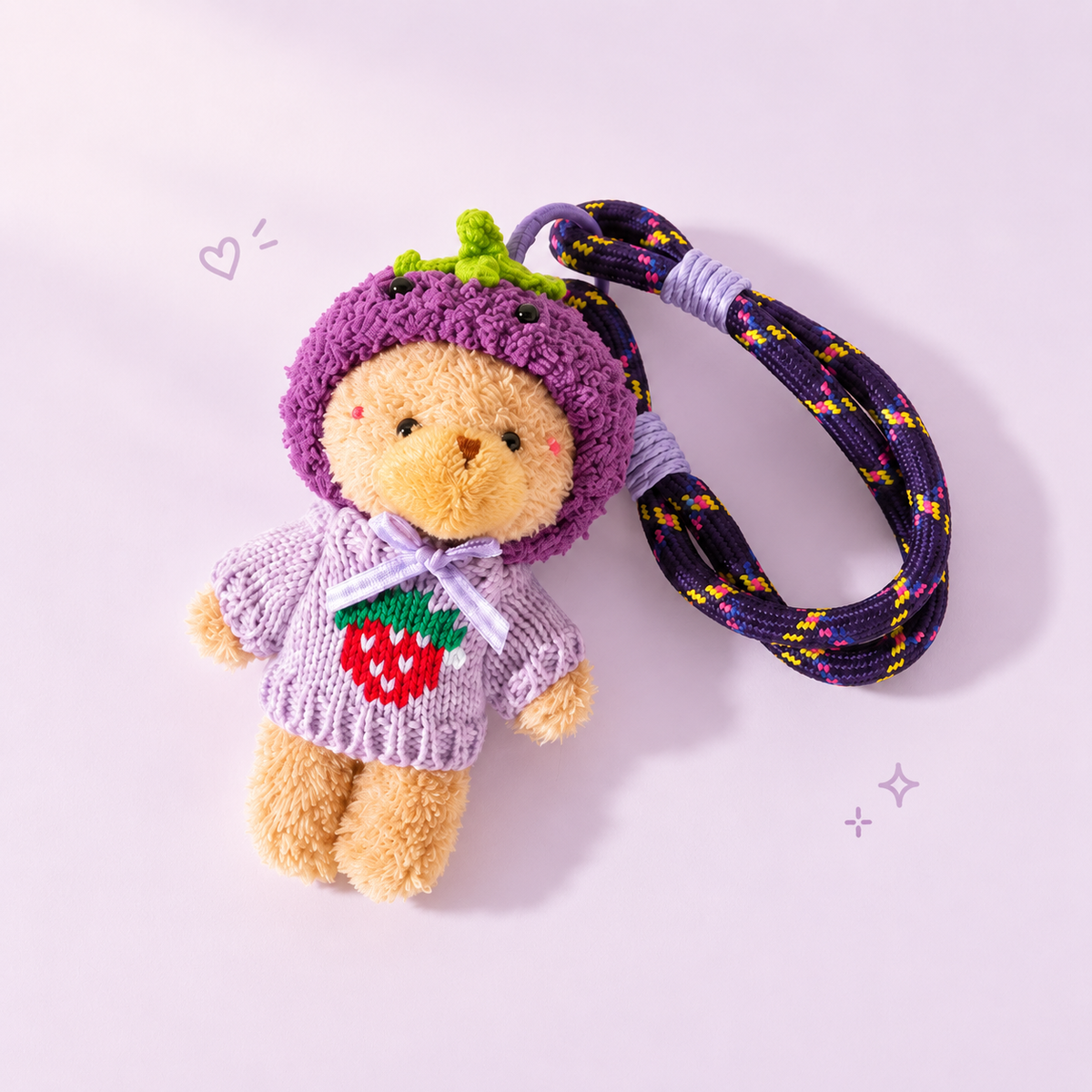 Hooded Sweater Bear & Rope Loop Charm on a soft pastel background
