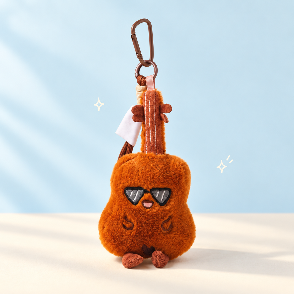 Little Melody Plush Instrument Bag Charm on a soft pastel background