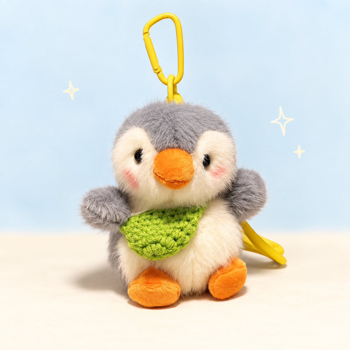 Penguin Crossbody Charm on a softly lit cream and pastel background.