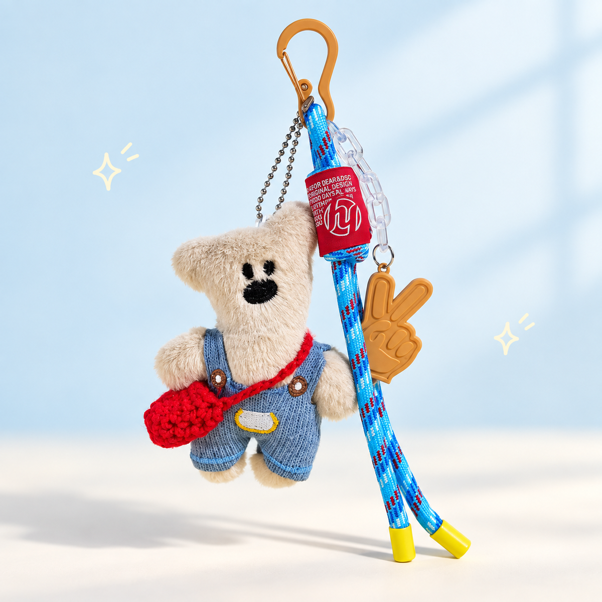 Teddy Bear Plush Keychain on a softly lit cream and pastel background.