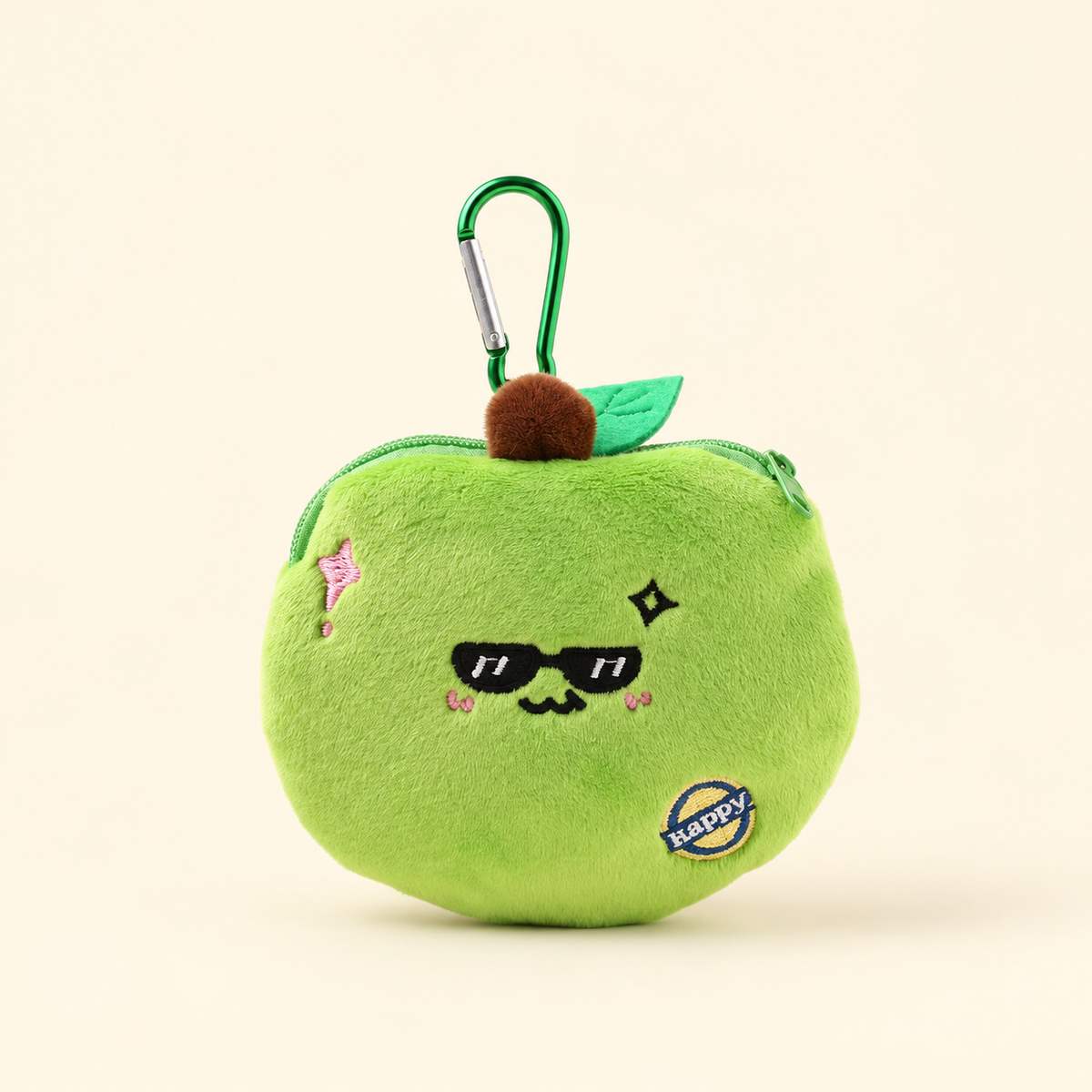 apple plush coin purse with green clip on ivory background