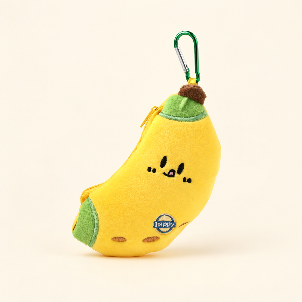 banana plush coin purse with green clip on ivory background