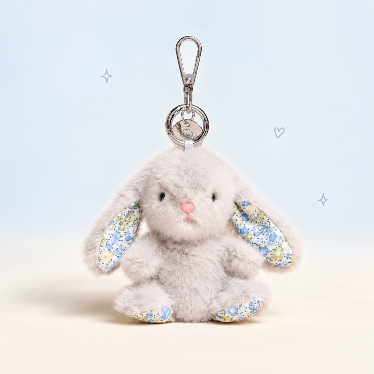 Big Ear Bunny Keychain on a softly lit cream and pastel background.