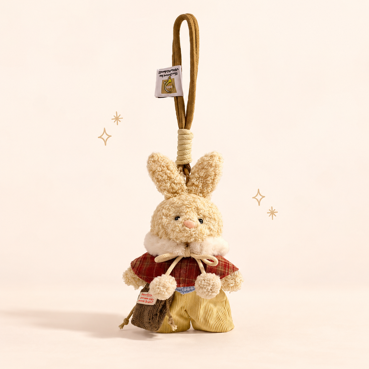 Bunny Plush Charm Collection on a softly lit cream and pastel background.