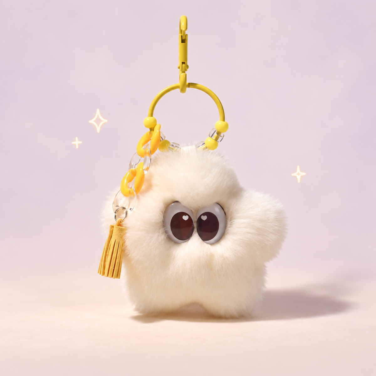 Cosmo Star Plush Charm on a softly lit cream and pastel background.