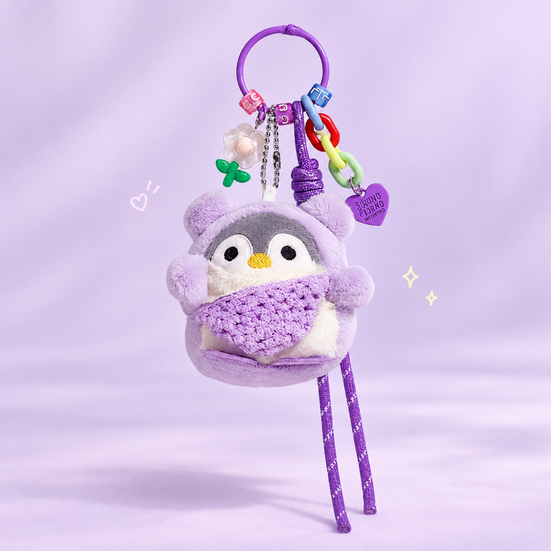 Cute Penguin Plush Keychain on a softly lit cream and pastel background.