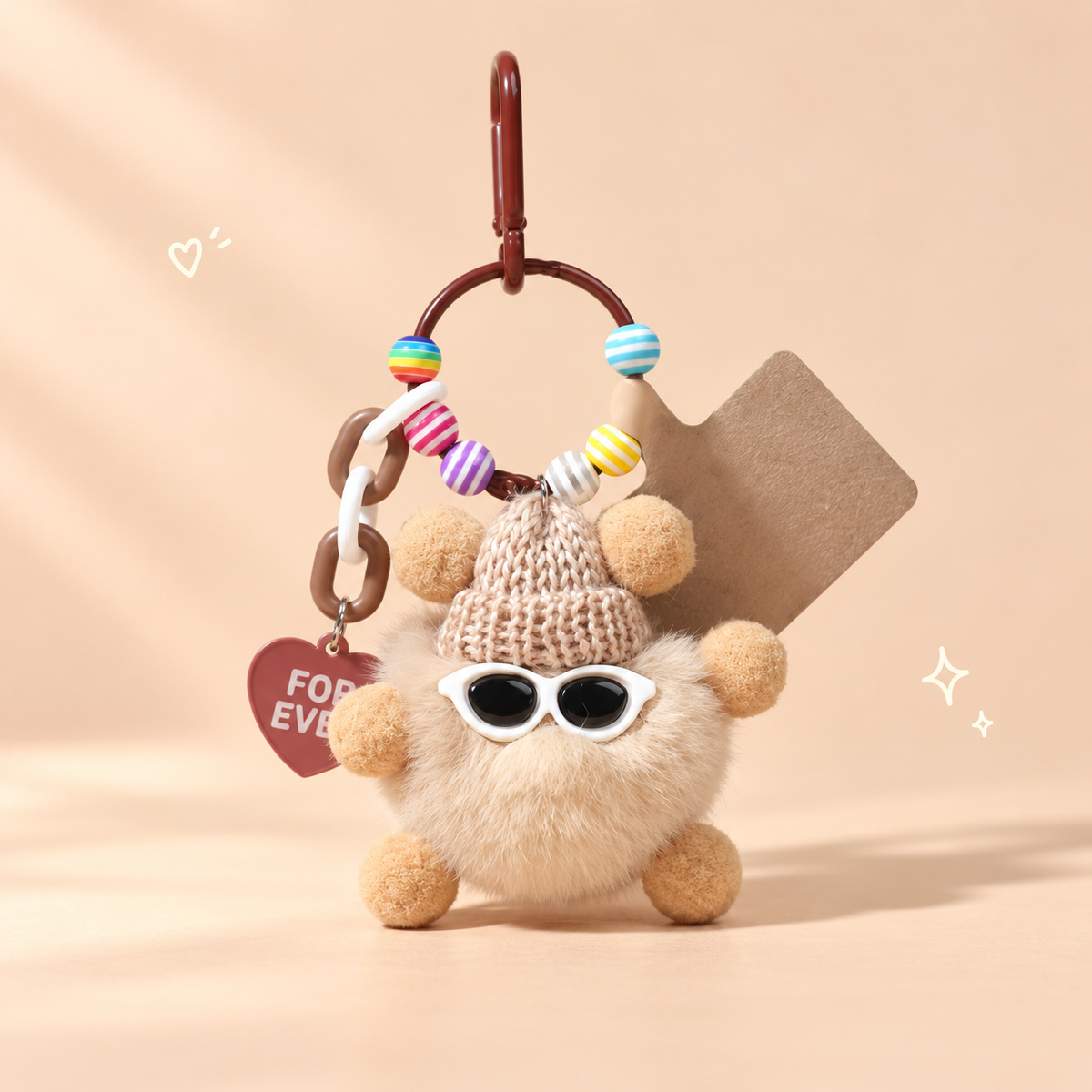 Fluffy Cool Buddy Keychain on a softly lit cream and pastel background.
