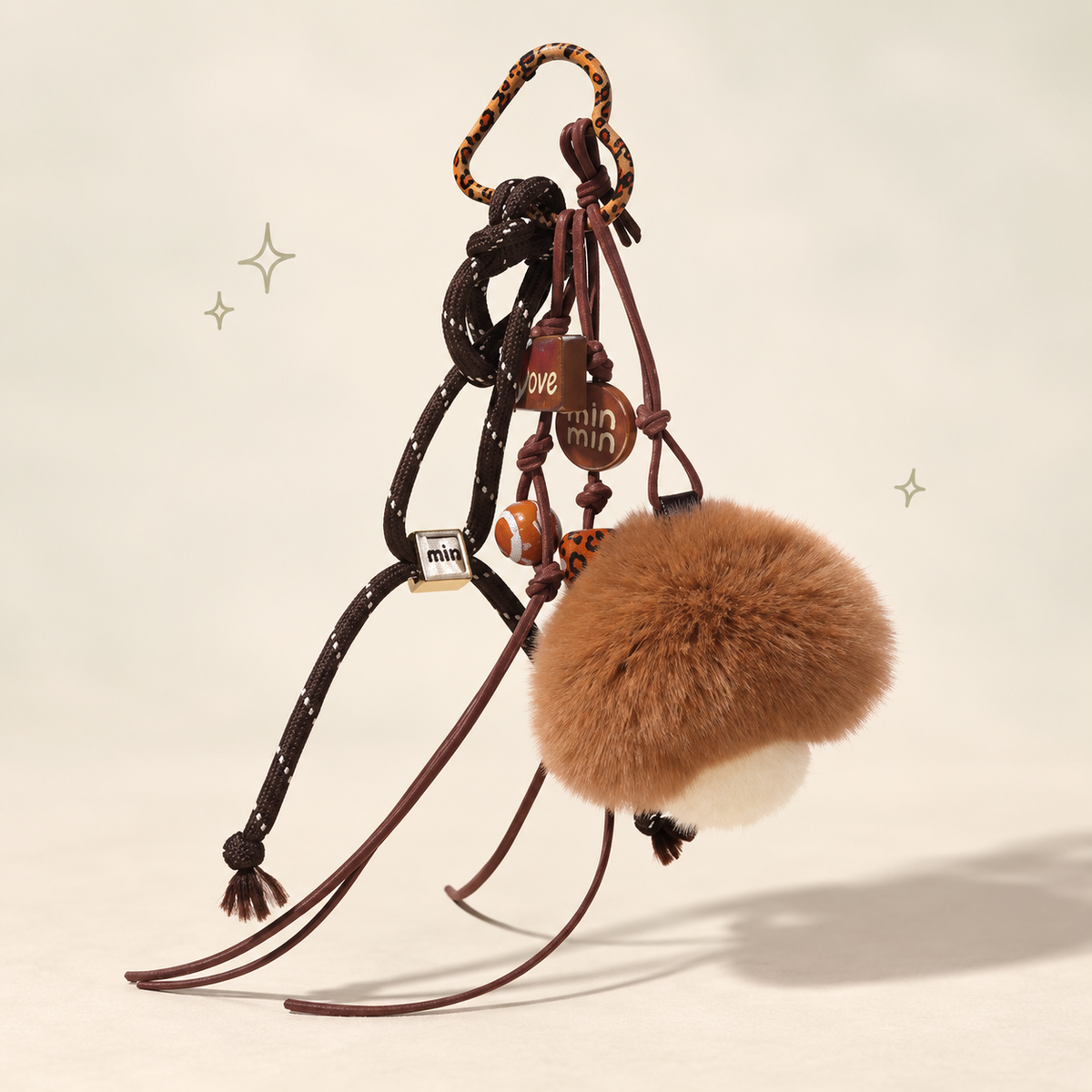 Fuzzy Mushroom Plush Charm on a softly lit cream and pastel background.