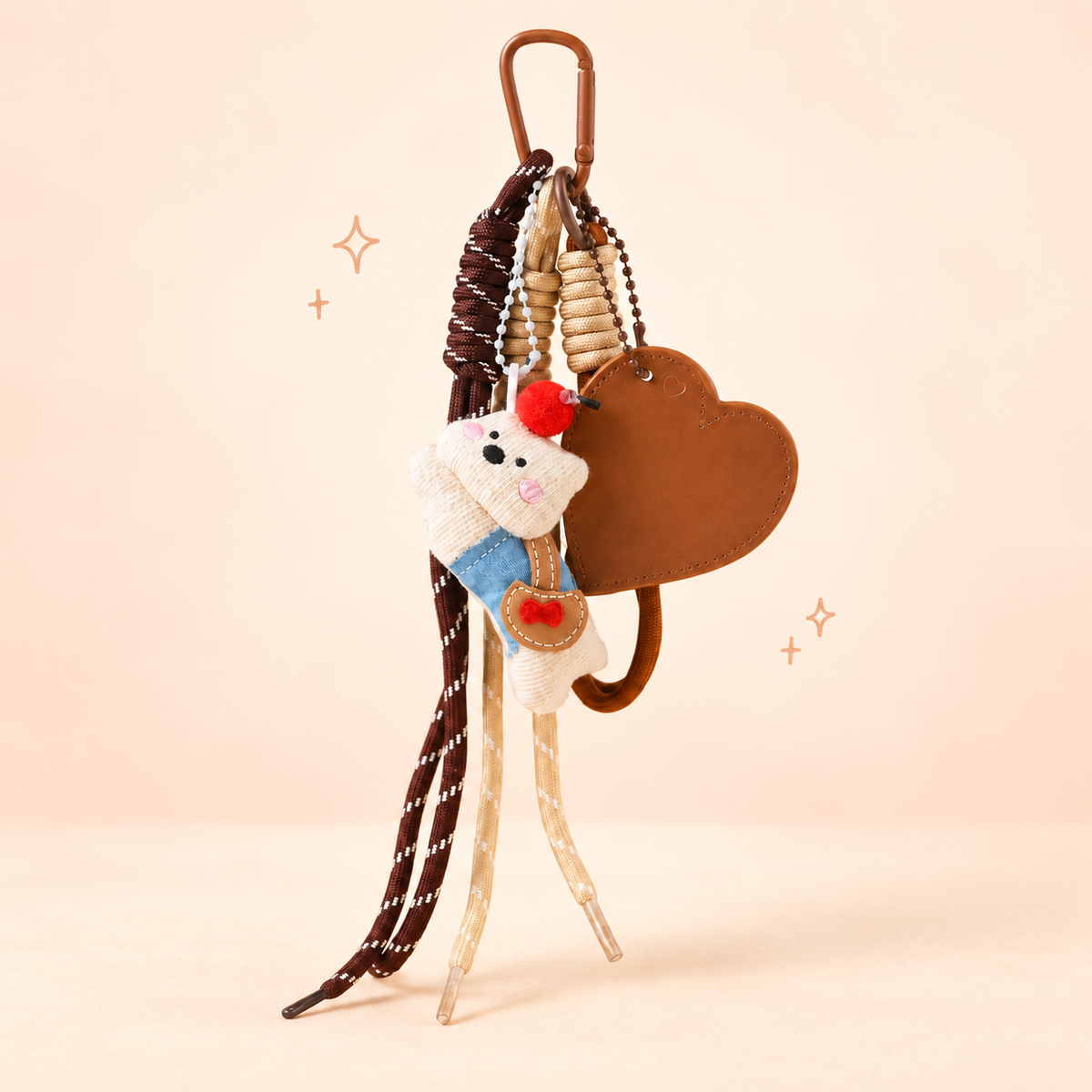 Heart Accent Rag Doll Dog & Bear Bag Charm on a soft pastel background
