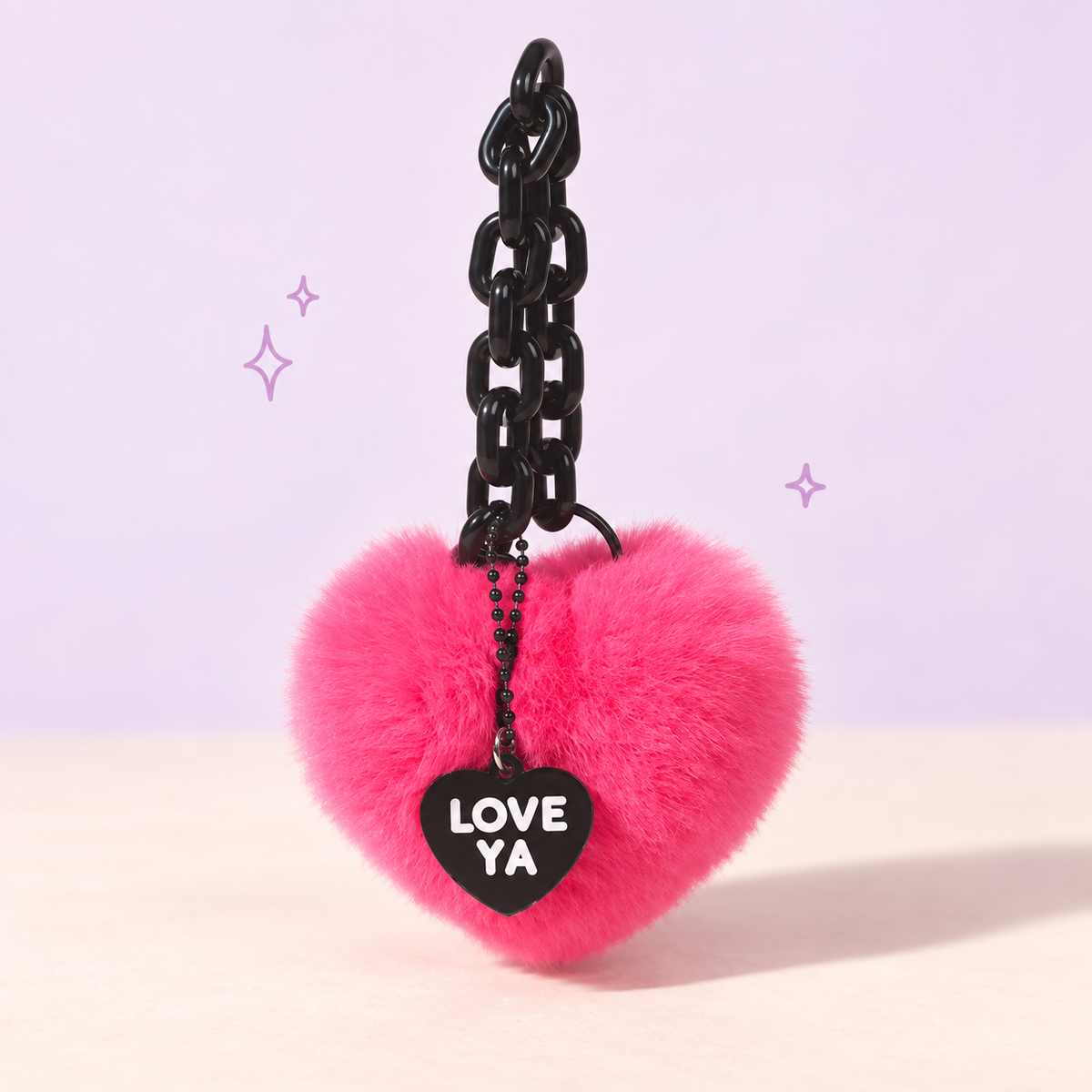 Love You Heart Plush Charm on a softly lit cream and pastel background.