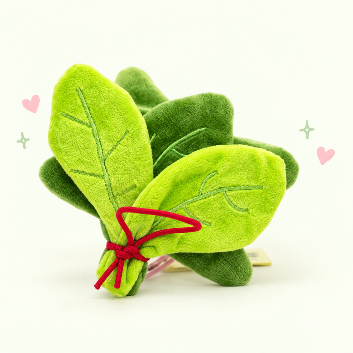 Lucky Citrus Leaf Charm on a softly lit cream and pastel background.