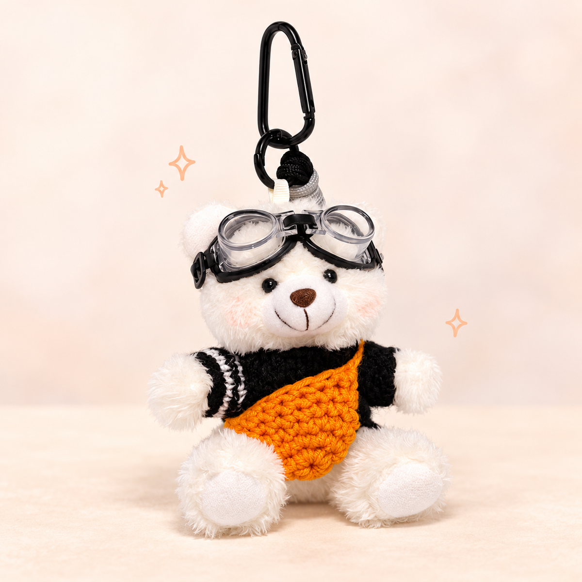 Plush Bear Charm with Goggles on a softly lit cream and pastel background.