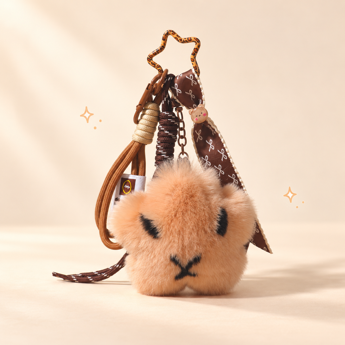 Starry Capybara Keychain on a softly lit cream and pastel background.