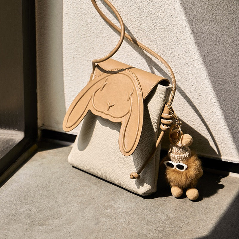 Khaki rabbit crossbody phone bag in natural light