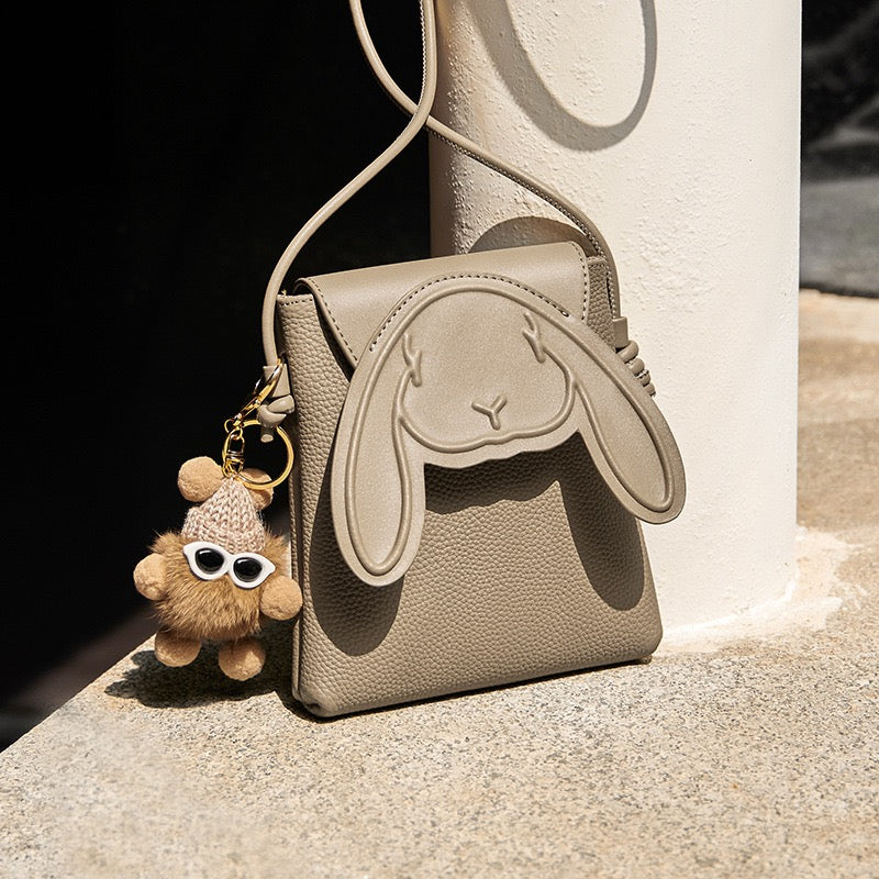 Taupe rabbit crossbody phone bag with matching strap and charm