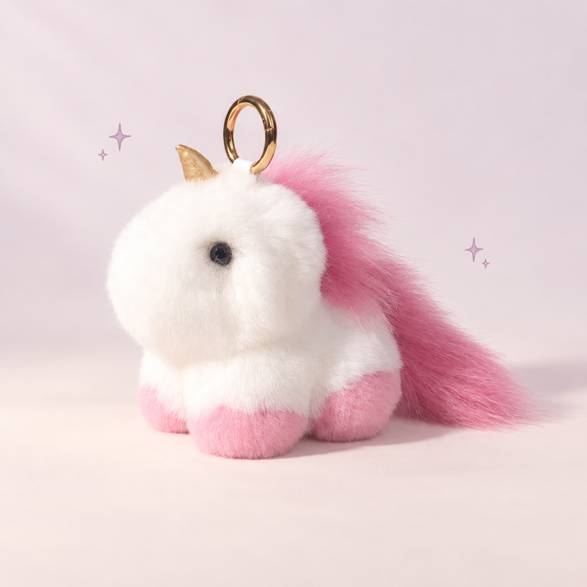Unicorn Plush Charm on a softly lit cream and pastel background.
